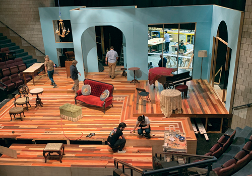 Students working on the set for a play